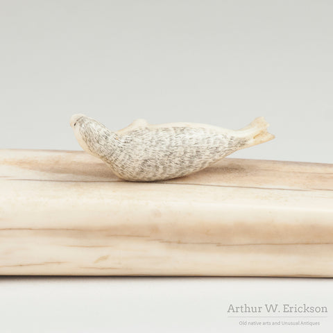 Inuit Carved Fossilized Ivory Cribbage Board with Scrimshawed Ivory Seals