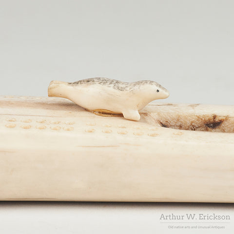 Inuit Carved Fossilized Ivory Cribbage Board with Scrimshawed Ivory Seals