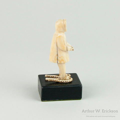 Inuit Ivory Carving of Man on Snowshoes