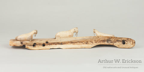 Three Inuit Carved Walruses on a Fossilized Ivory Sled Runner