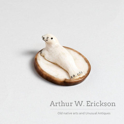 Small Walrus Ivory Resting Seal on a Mount of Fossilized Walrus Ivory