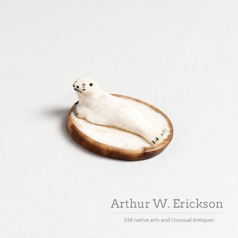Small Walrus Ivory Resting Seal on a Mount of Fossilized Walrus Ivory
