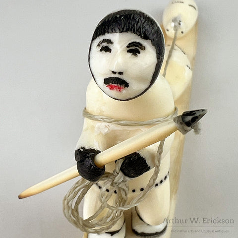 Ivory carving of Eskimo Hunter with Two Seals